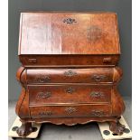 A walnut veneered Dutch secretaire, ca. 1900 after an older example. Secret compartments