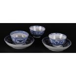 Two porcelain saucers and three cups, all with dancing fools decor. China, Qianlong.