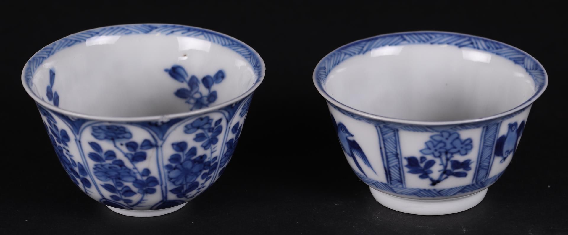 Two various porcelain bowls, both with flower beds decoration, one with bird decoration.