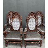 A set of four Neo Renaissance French armchairs with lion heads and twisted pillars.