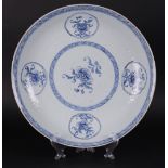 A large porcelain dish with floral (relief) decor. China, Yongzheng.