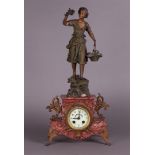 A mantel clock with clock image after Ernest Rancoulet (1870 - 1915), "Cueilette" (= The picker).