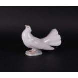 A porcelain pigeon, marked Lladro.