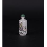 A porcelain Famille Rose snuff bottle decorated with various figures. China, 19th century.