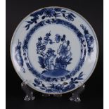 A porcelain plate with prunus-branch, and chrysanthemum branch-on-a-rock decor. China, Qianlong.