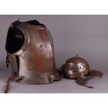 A decorative cuirass and a replica Roman helmet. 20th century.