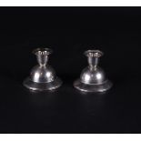 A pair of silver candlesticks. Year letter D for: '1938'. 155 grams.