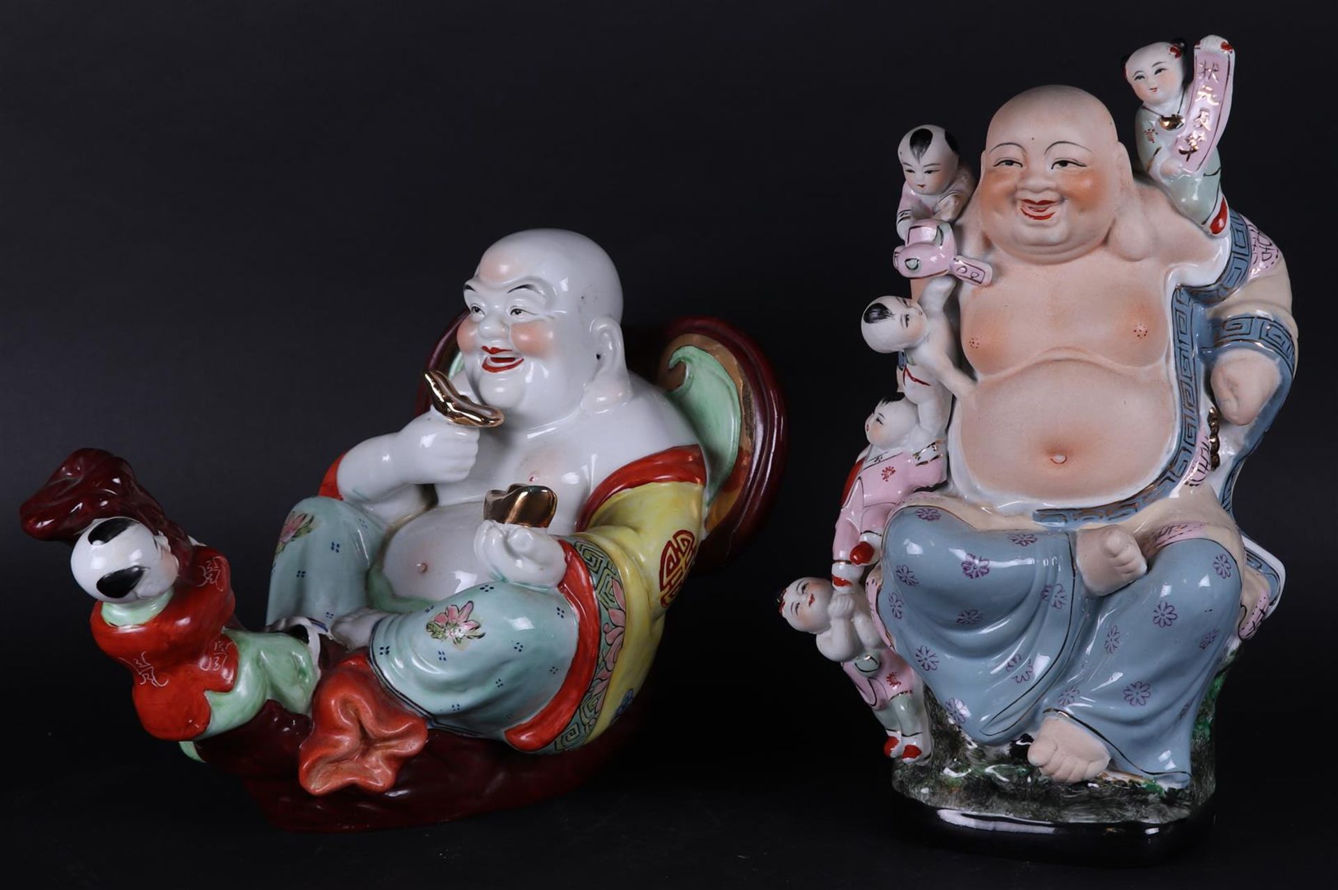 A lot with two porcelain "Happy Buddhas". China, late 20th century.