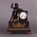 A patinated bronze mantel clock with a pearl finder's bell,