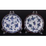 Two porcelain plates with floral decor and both with capuchin backs. China Qianlong.