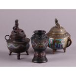 A lot with bronze cloisonne objects consisting of two incense burners and a vase.