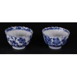 Two ribbed porcelain bowls with rich floral decoration in borders, both marked on the bottom.