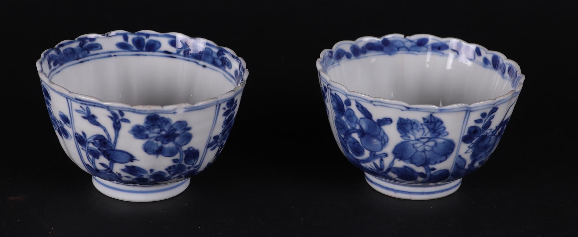 Two ribbed porcelain bowls with rich floral decoration in borders, both marked on the bottom.