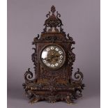 A heavy bronze mantel clock with matching key, ca. 1880.