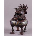 A bronze cloisonne incense burner in the shape of a Foo dog. China, 19th century.