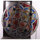 An antique stained glass rose window.
