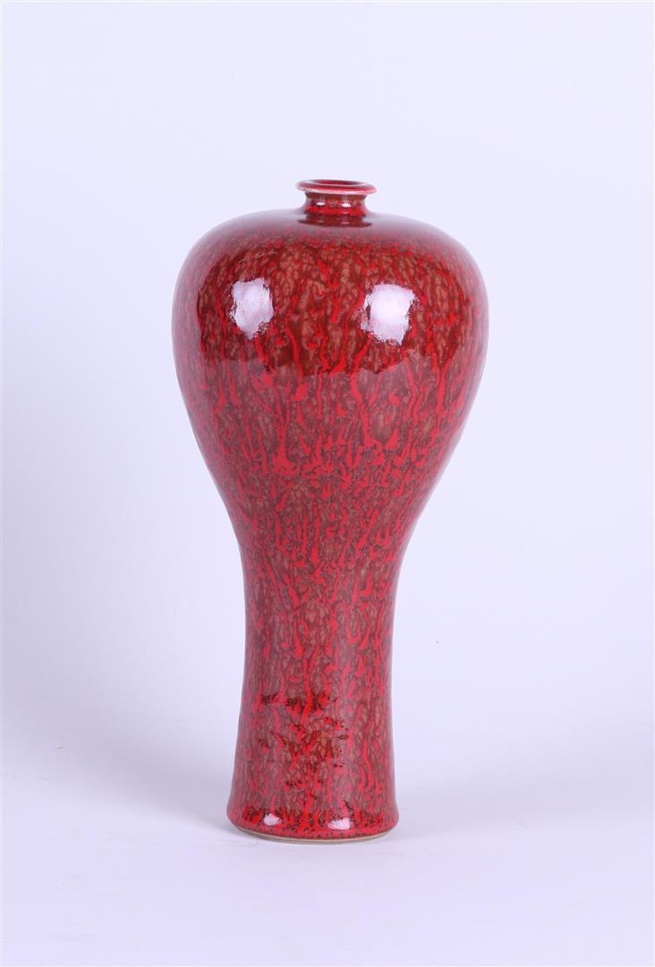 A red-glazed Meiping vase, marked Kangxi. China, 20th century.