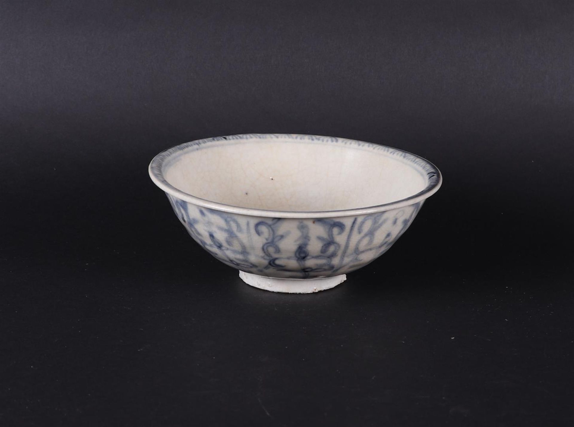 A gray bowl with an unglazed inner rim (stacking bowl) with floral decoration. Vietnam,