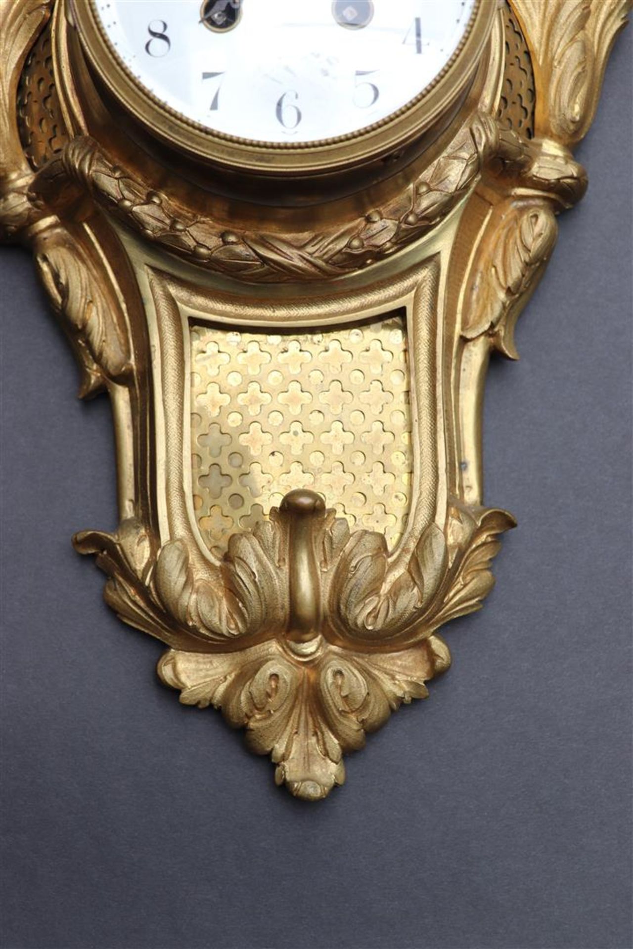 An ormolu plated cartel clock decorated with vase work and garlands, France late 18th century. - Image 4 of 4