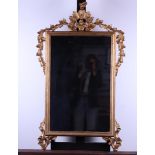 A gilded Louis Seize carved wood and gesso mirror, 18th century. Replace glass. Damage to the top.