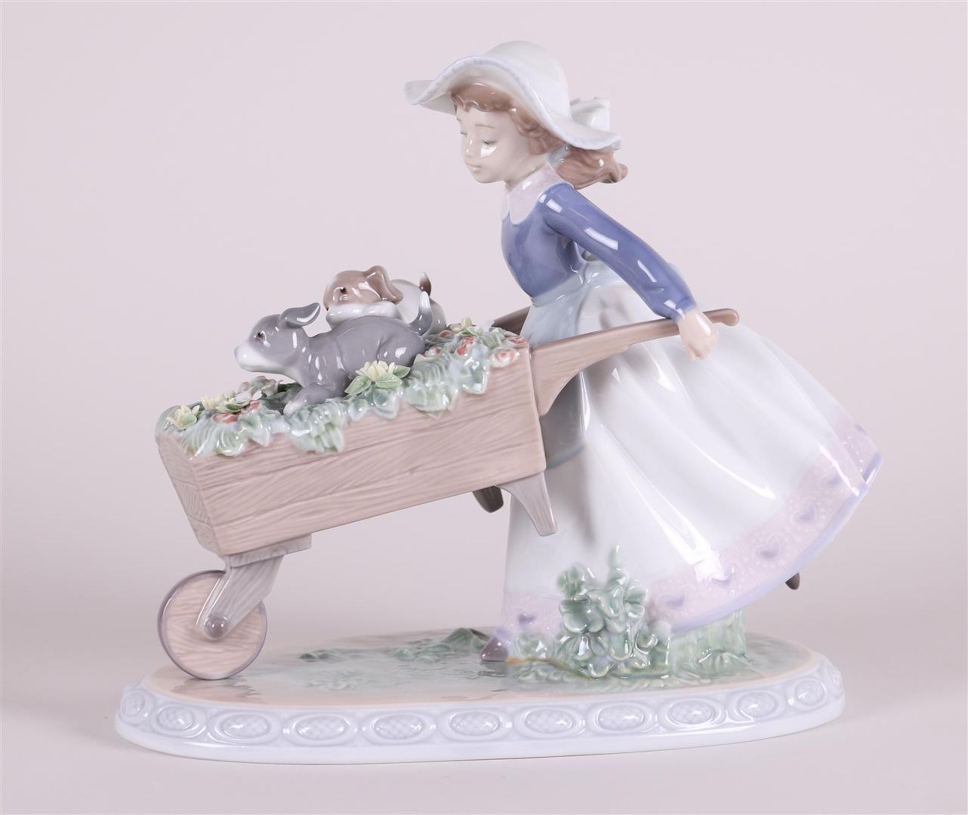 A porcelain group of a girl with a wheelbarrow. Ladro, Spain. - Image 2 of 4