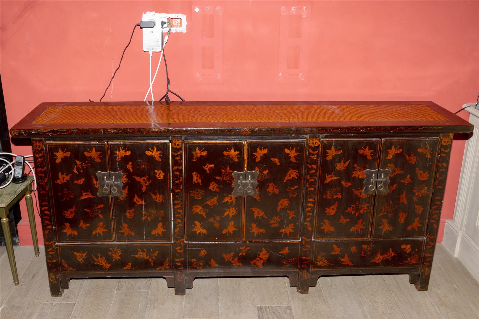 A Chinese lacquered sideboard.