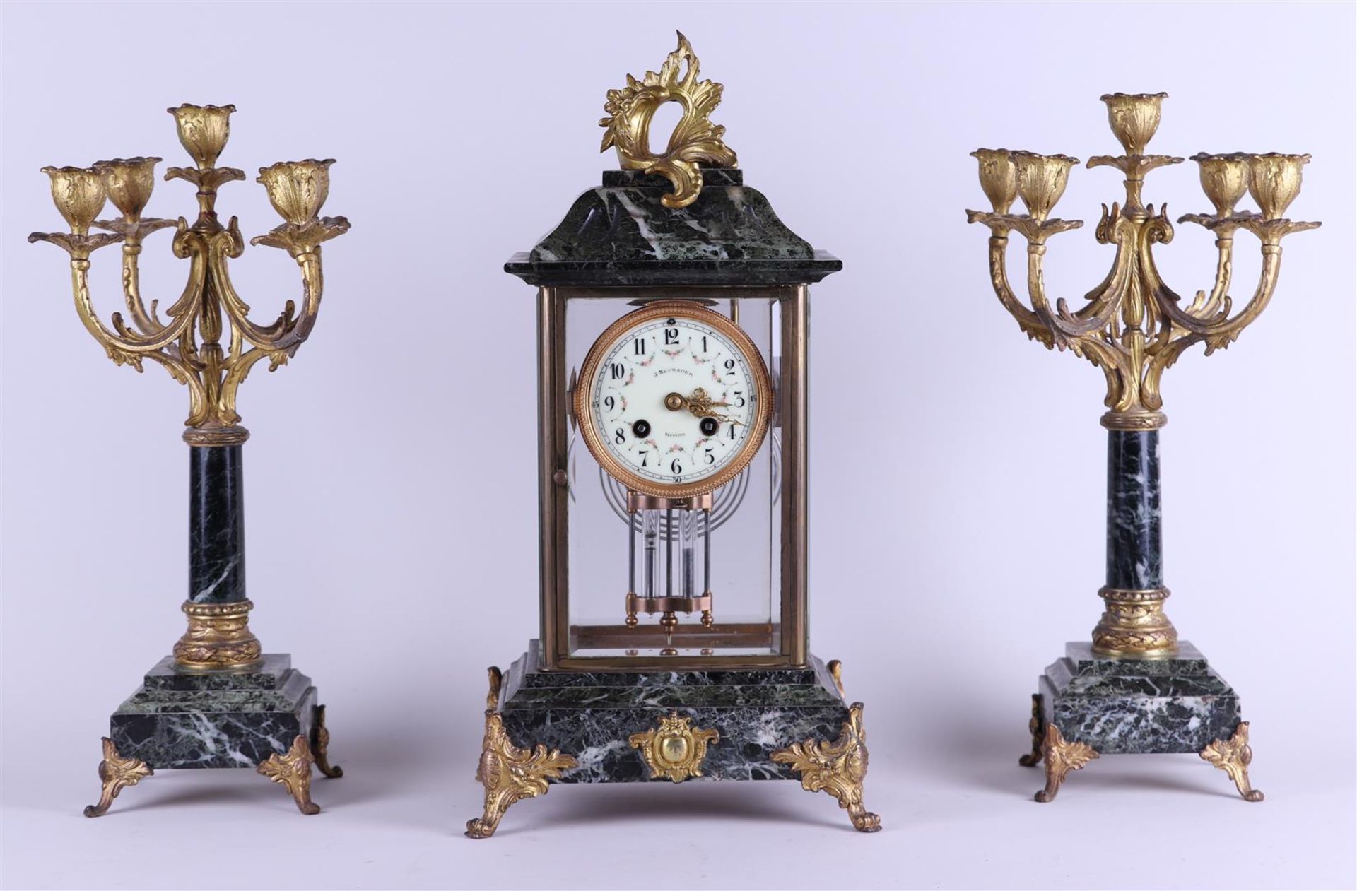 A Garniture de Cheminee consisting of a clock with cut glass walls, a mercury pendulum