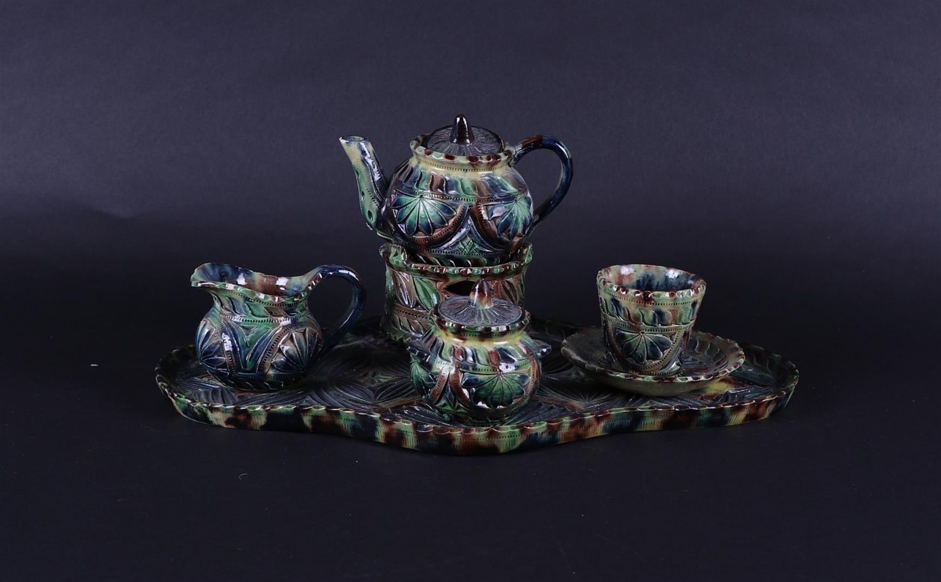 A Frisian carved earthenware tea set. 19th century.