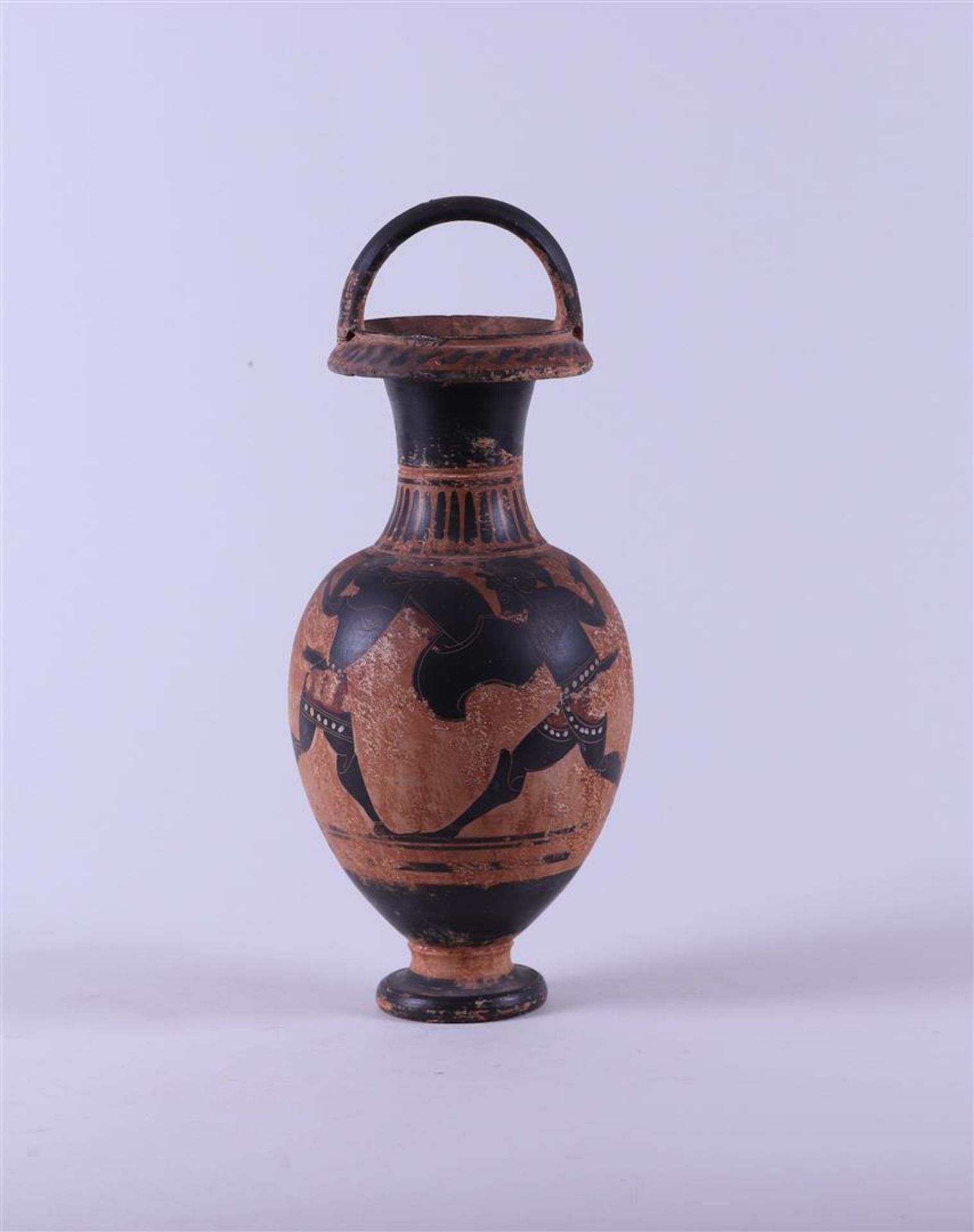A Greek black-figure vase, incised and heightened with white. 