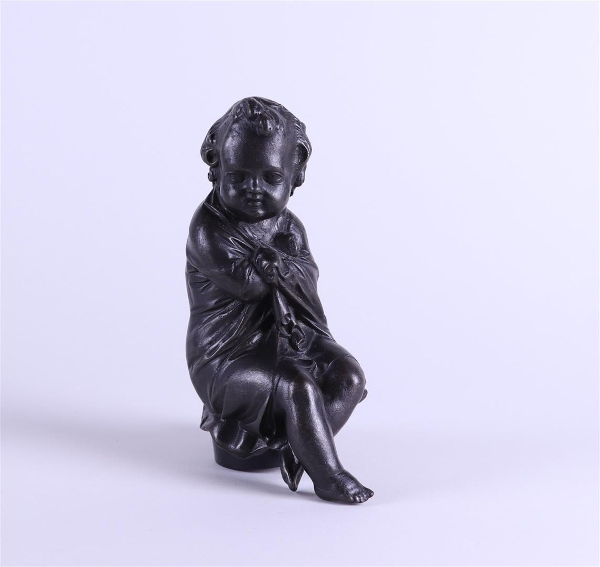 A 19th century brown patinated bronze of a putto, personification of winter. - Image 3 of 4