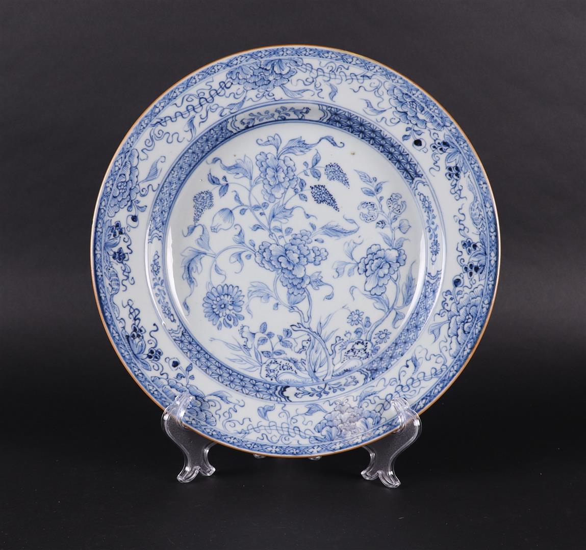 A porcelain dish with rich floral decoration of flowers on a rock, 