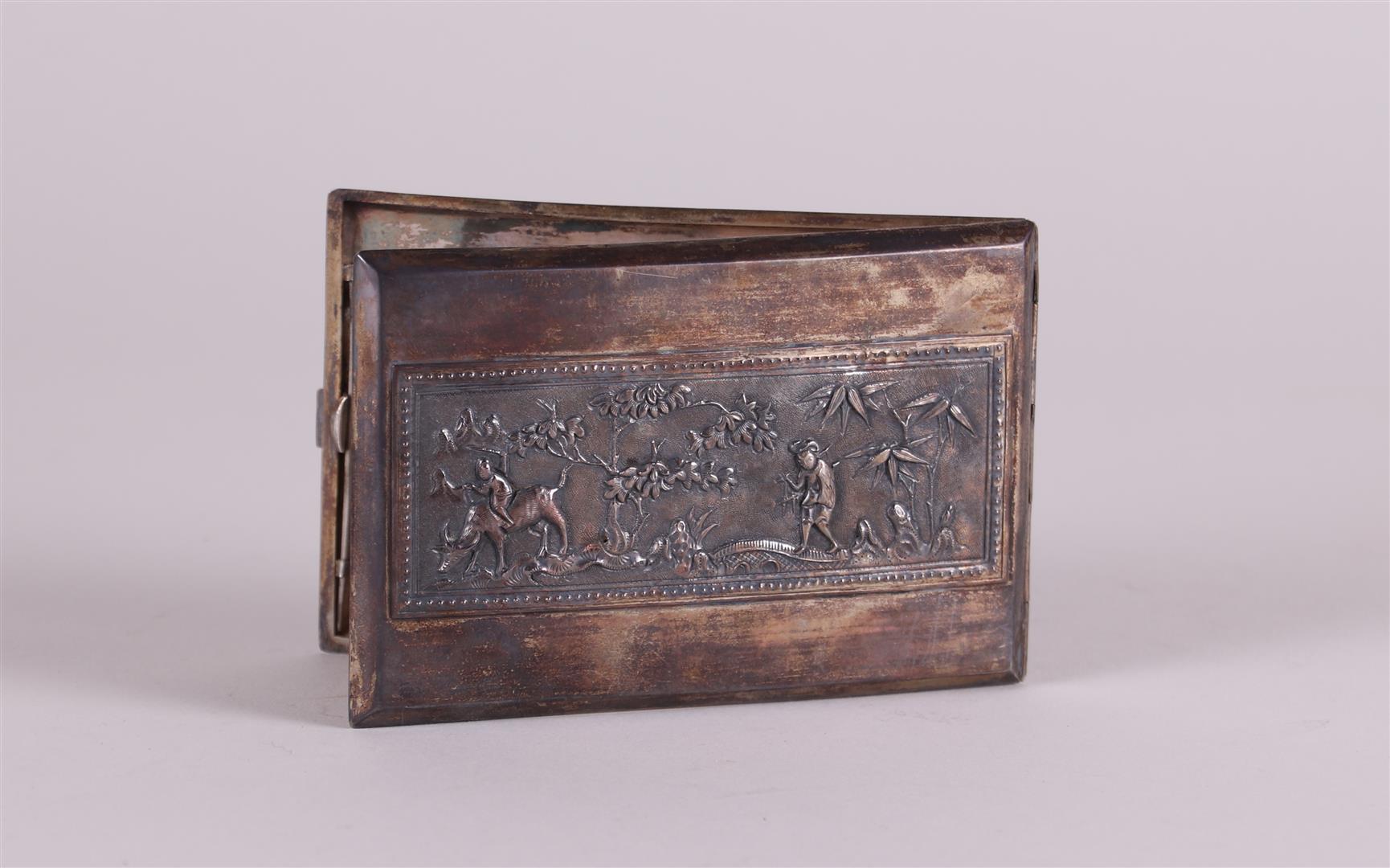 A 'Djokja' silver cigarette case decorated with figures in a landscape. China, 20th century.