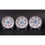 Three porcelain Imari plates with floral decoration. China, Qianlong.