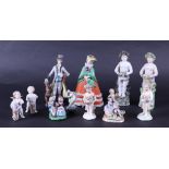 A lot consisting of (7) Derby porcelain angels with a flower basket. T