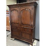 A large chestnut linen cupboard, 20th century, after an older example. In very good condition.