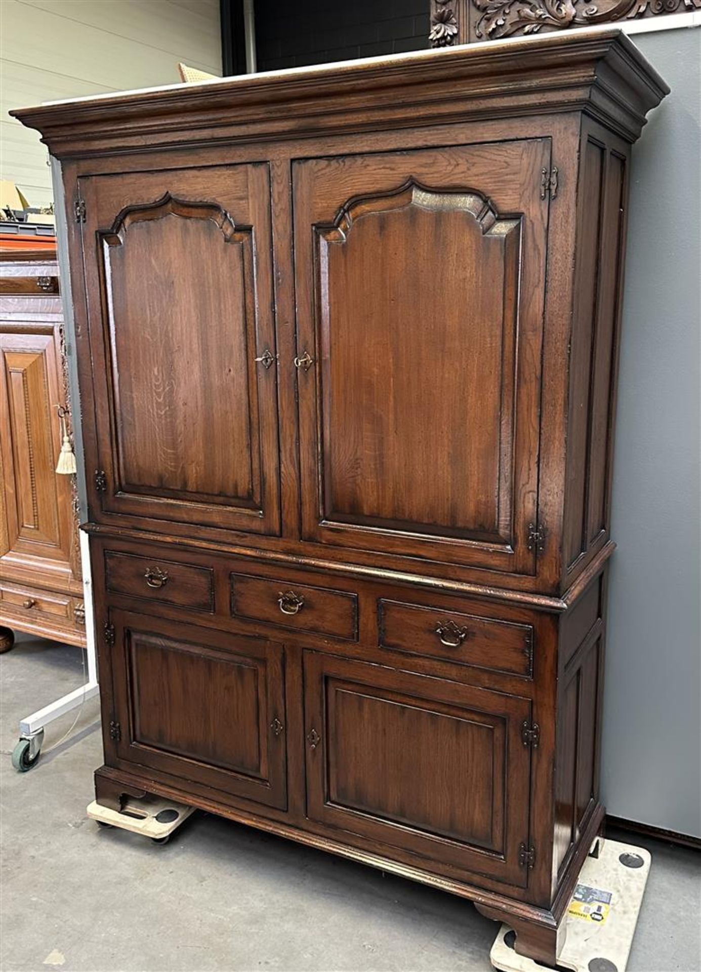 A large chestnut linen cupboard, 20th century, after an older example. In very good condition.