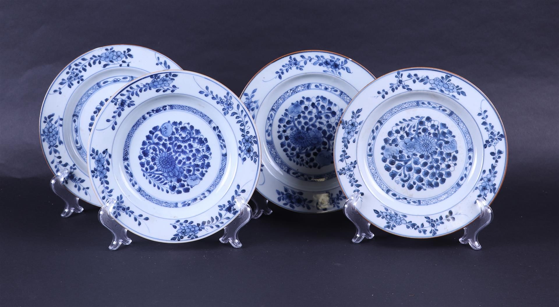 A set of four porcelain plates with a floral decor. China, 18th century.