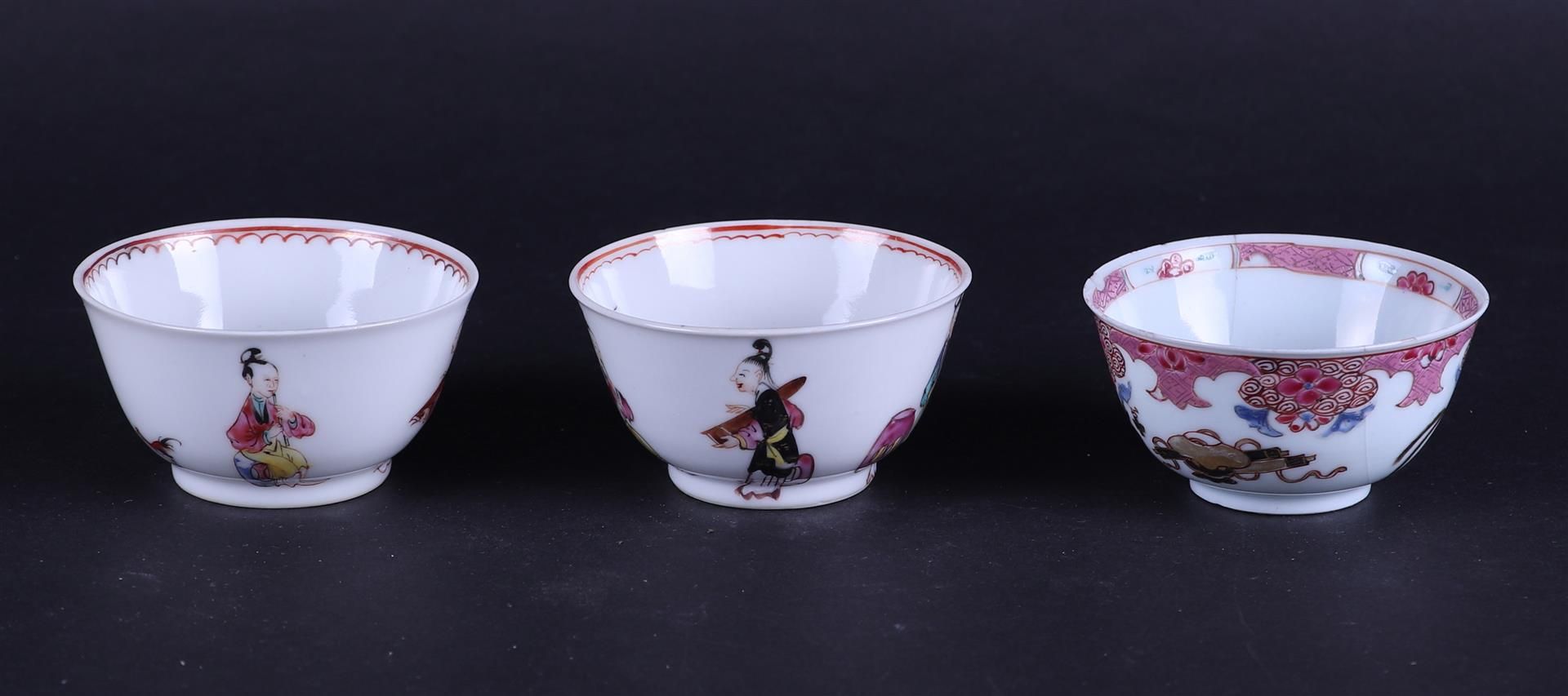 A lot of three porcelain Famile Rose cups and saucers, two of which are decorated with figures..