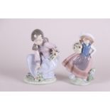 A lot with two porcelain figures of girls picking flowers. Ladro, Spain.