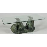 A bronze sculpture of a reclining bear cub with hard glass top. Coffee table.