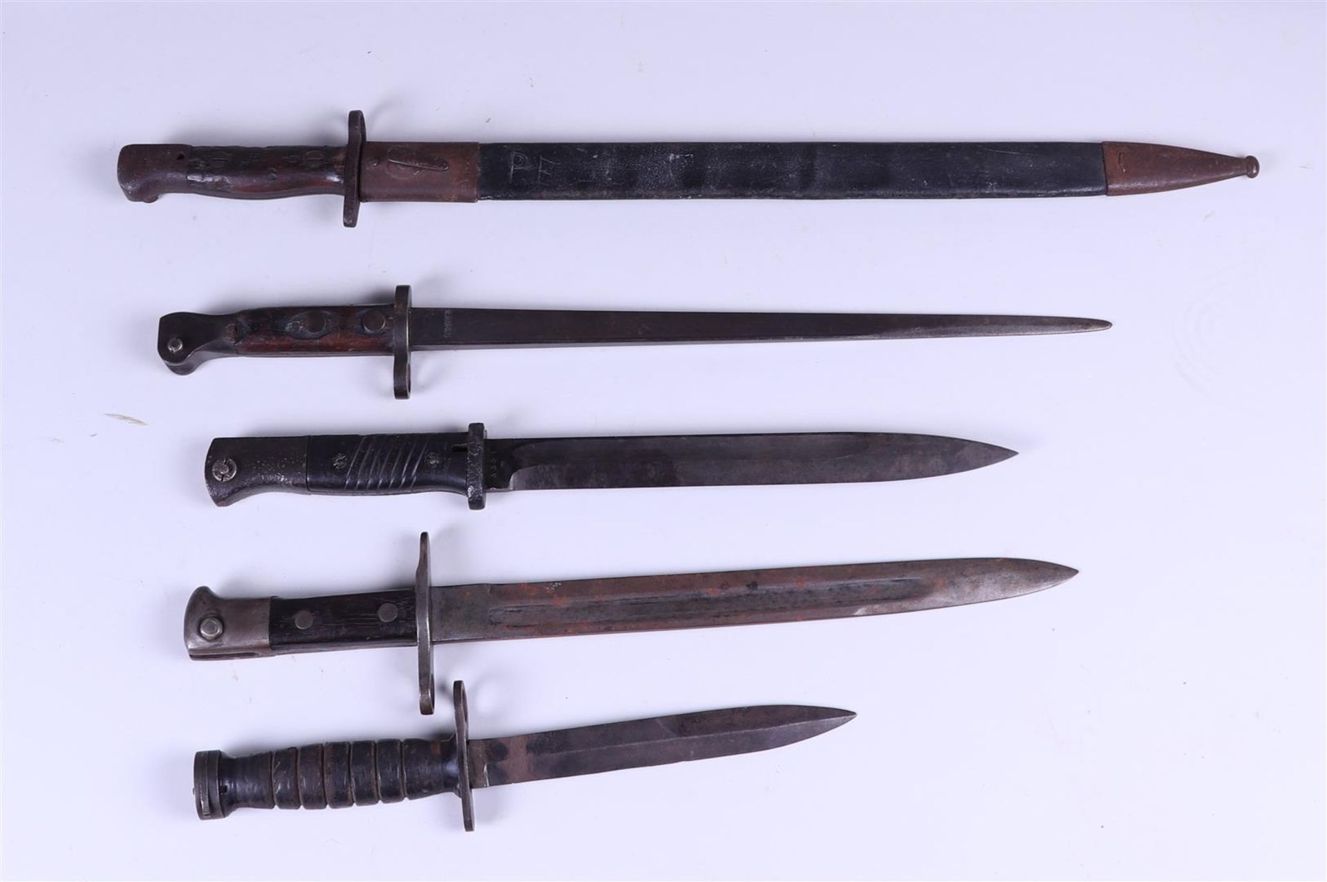 A lot consisting of (5) various bayonets including Spain, circa 1913, Mauser, World War II. 