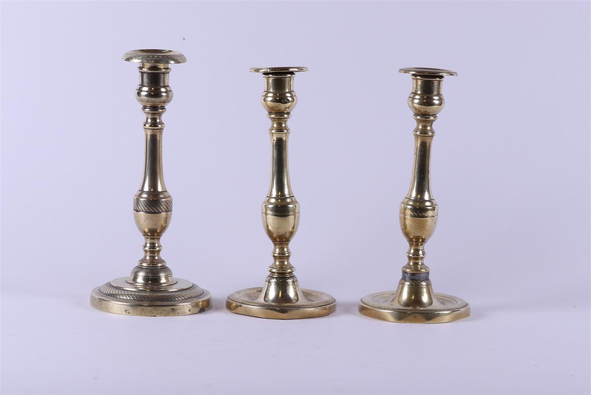 A lot consisting of (3) candlesticks, 19th century.