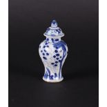A porcelain lidded vase with floral decoration and grapes in between. China, Qianlong.