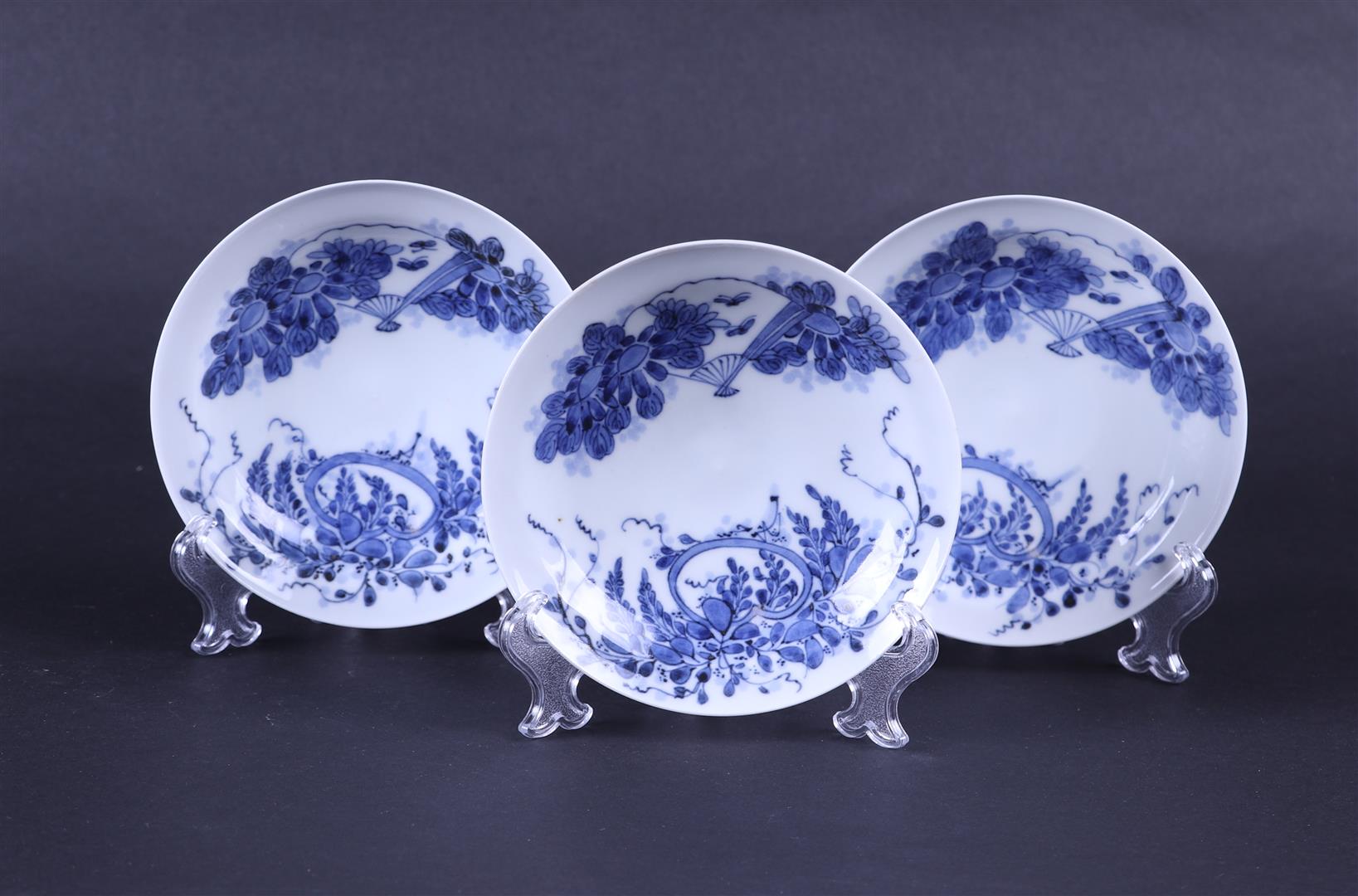 A set of three blue and white lidded cups and saucers, marked. Japan, 19th century. - Image 2 of 3