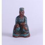 A green glazed pottery sculpture of an immortal, China, Ming period (?).
