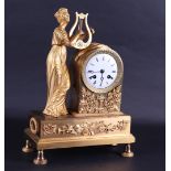 A 19th century fire-gilt mantel clock with harp-playing muse.