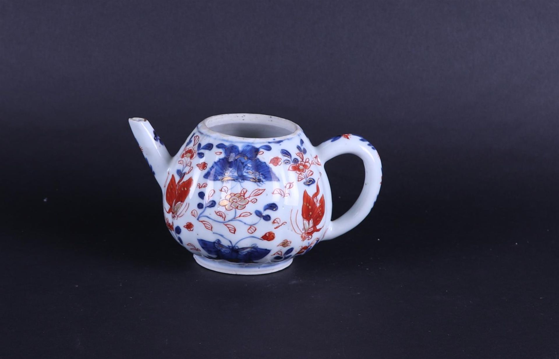 A porcelain ribbed Imari teapot. China, . 