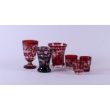 A lot containing red Bohemian glass including three vases and three glasses.