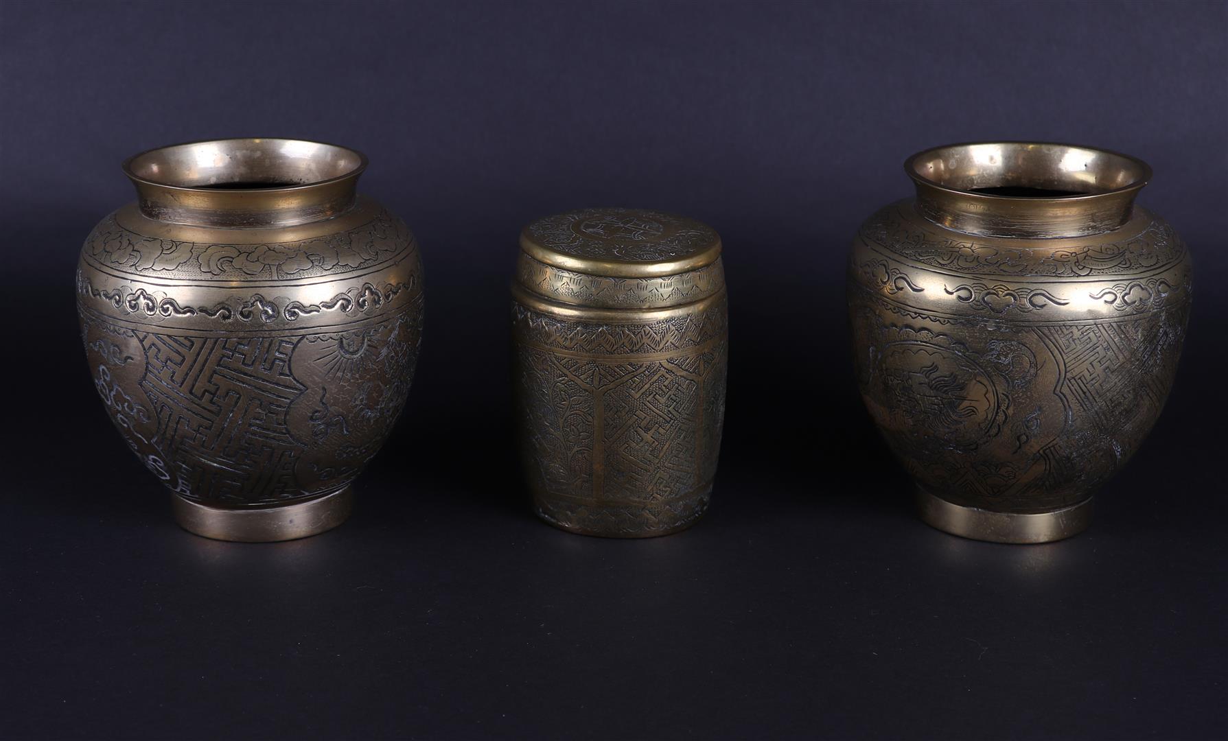 A lot of 3 brass jars consisting of two ginger jars and a lidded jar. Asia, early 20th century.