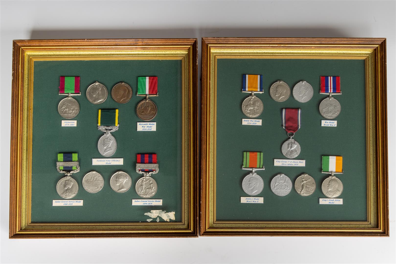 A lot consisting of (2) sets of framed medals including WWI and II.